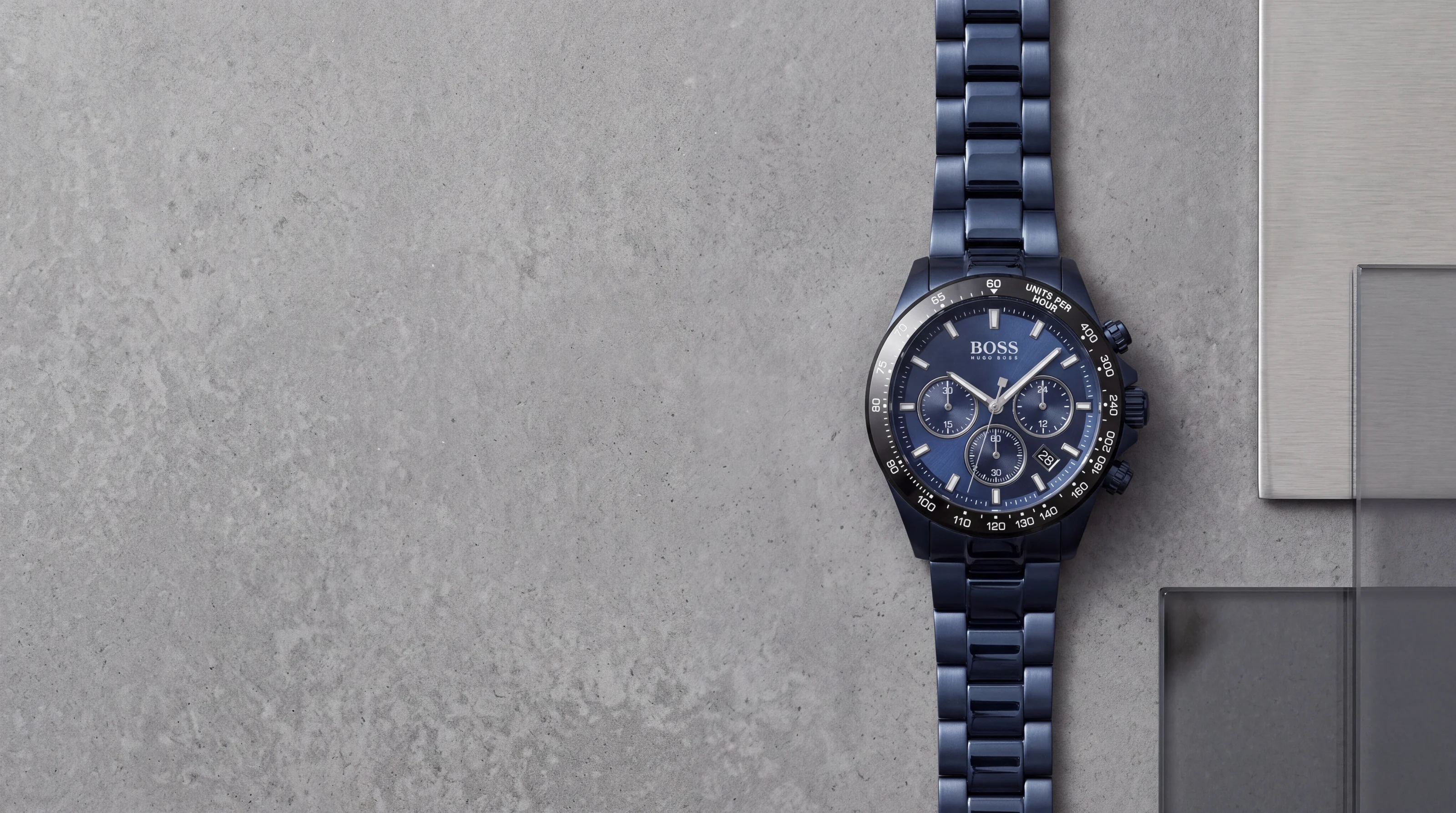 HUGO BOSS Hero 1513758 all-blue chronograph with black tachymeter bezel on grey polished concrete